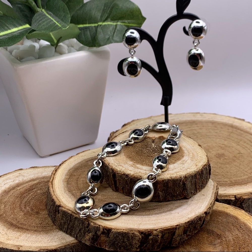 Set of matching bracelet and pierce earrings.